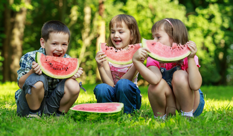 Kids eating watermelon at 4th of July Celebration in Nashville and middle Tennessee