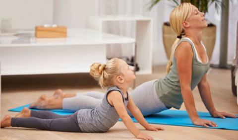 Nashville's top Yoga Studios Mother and Daughter practicing yoga in Nashville